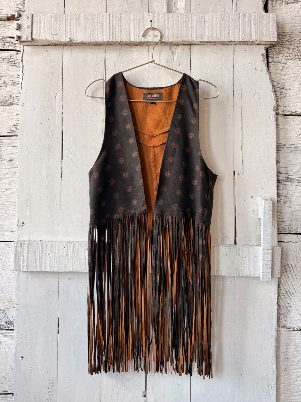 Shyanne Country Wear western fringe vest in a dark brown/charcoal medallion prin